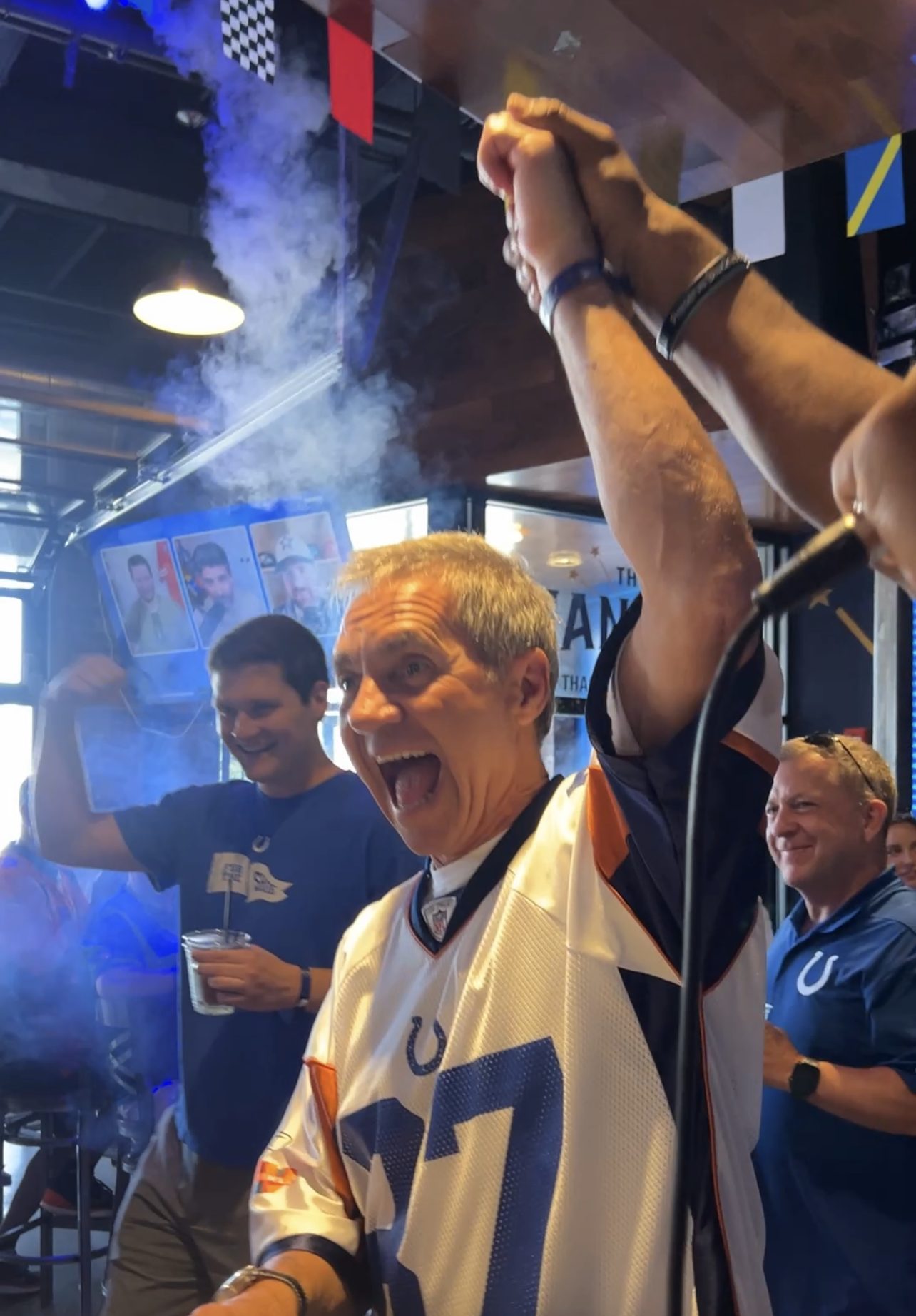 A Colts fan celebrating a competition win inside The Hangar